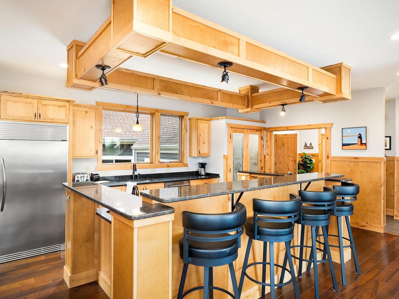 The main kitchen with granite counters and an island